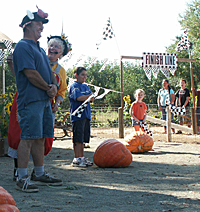 Guests have a great time at the Pig Races at Bishop's Pumpkin Farm in Wheatland, California