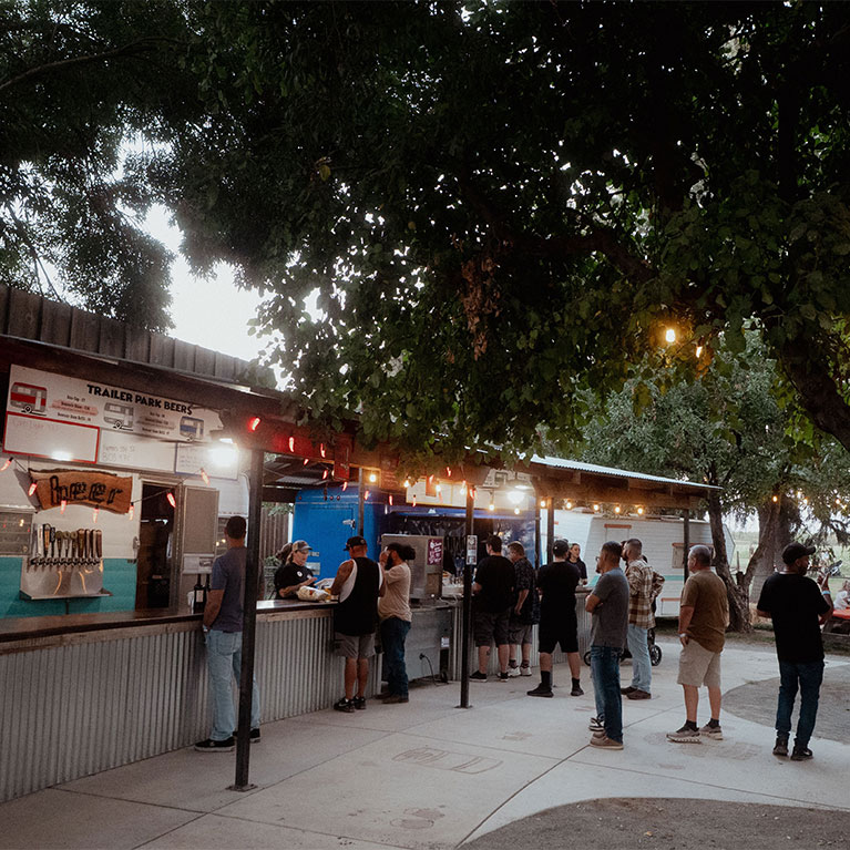 Stop by for local beers, wines, and farm fresh kettle corn just on the Other Side of the Tracks.